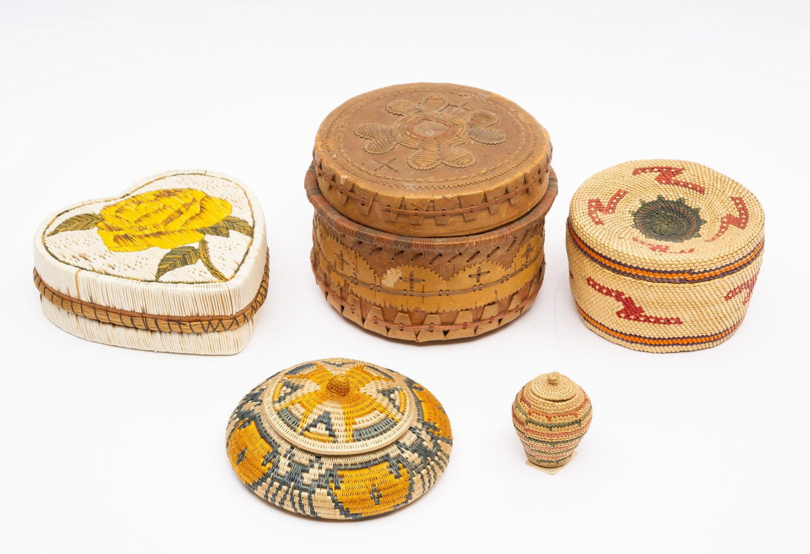 Group of 5 Tribal Baskets: A group of five small tribal baskets including quillwork Anishinaabe (probably Canadian) baskets along with an unusual basket, probably Quileute, incorporating a plow into the design. Measurements: 1"