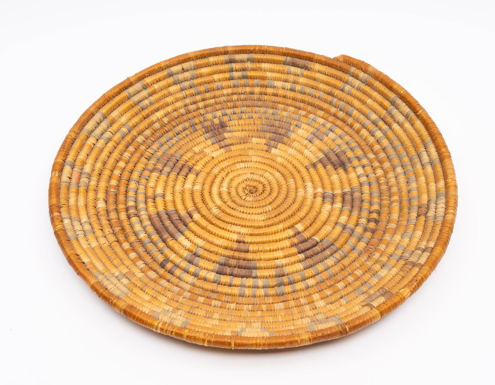 A Navajo Wedding Basket: A very fine mid 20th century Navajo wedding basket with typical decoration. Measurement: 15". Condition: Overall good.