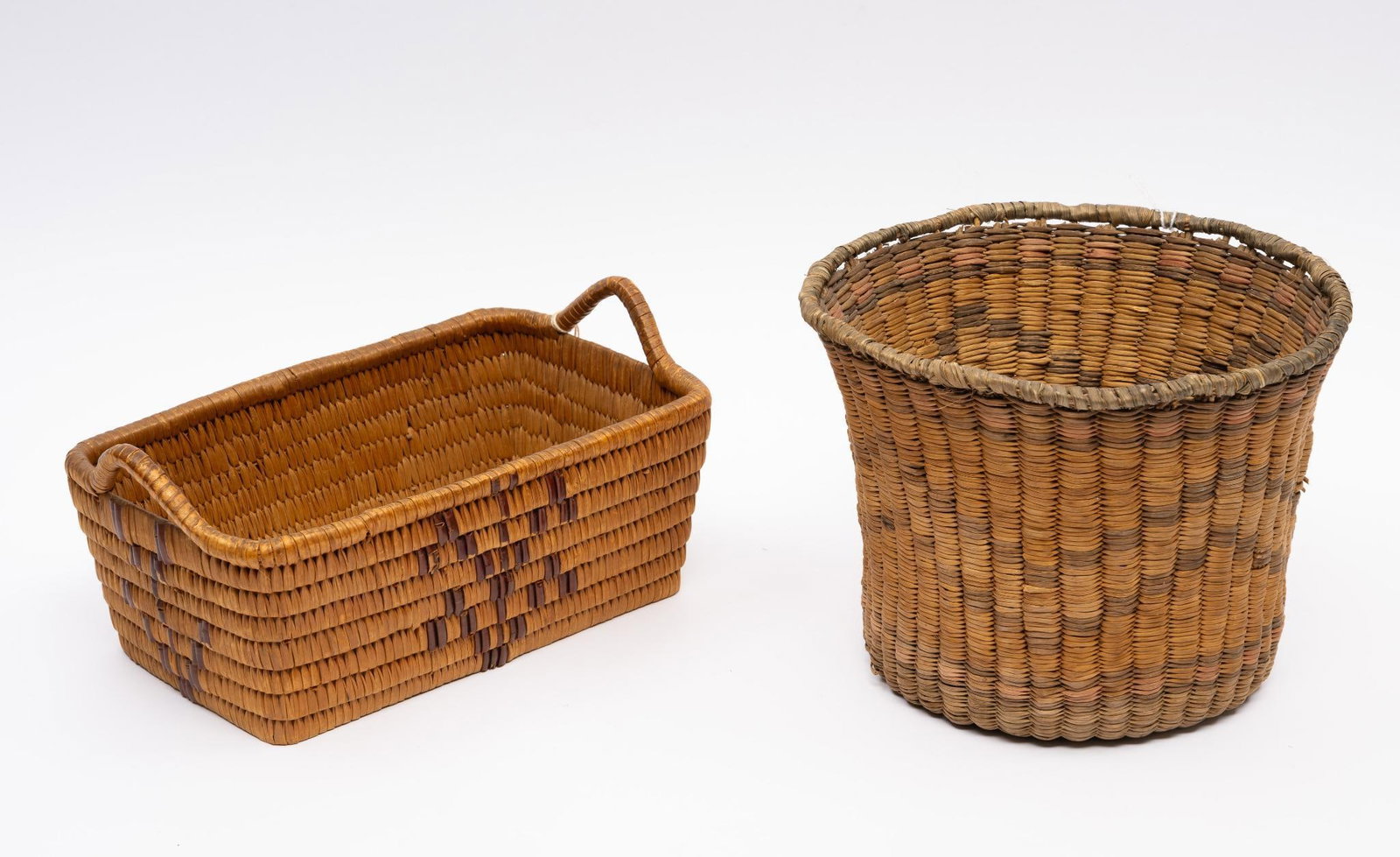 Papago Letter Basket and Tribal Basket: A Papago rectangular letter basket together with a second straight sided basket possibly California tribal. Measurement: round basket -- 8-3/4" ; letter basket -- 6" x 9-3/4". Condition: Overall good.