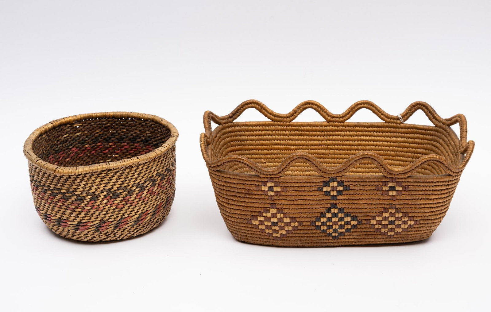 2 Tribal Baskets: A very fine and unusual tribal made rectangular letter basket together with a mid-western splint basket. Measurements: 7-1/4" to 13". Condition: Overall good.