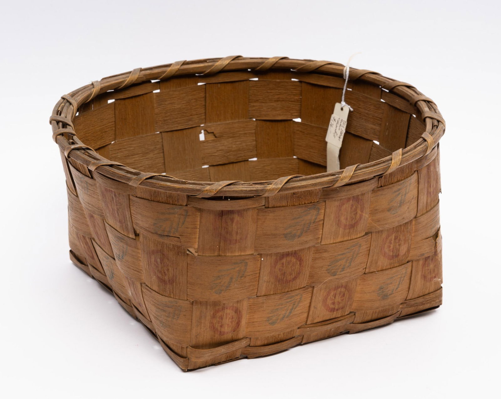 Iroquois "Potato" Stamped Basket: A large rectangular splint basket with potato stamp decoration. A classic example of Iroquois-produced baskets. Measurements: 12-1/4" to 11-3/4". Condition: Overall good with stamps a bit faded.