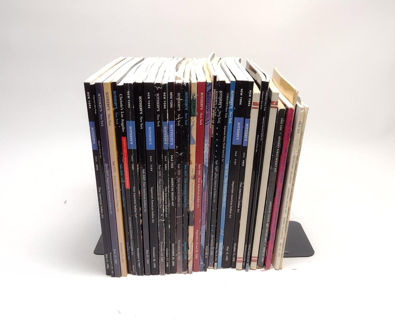 33 Christie's & Sotheby's American Indian Auction Catalogs: NOT ELIGIBLE FOR IN-HOUSE SHIPPING. From 1980s, 1990s, and 2000s. Condition: Some tearing of pages, but overall good.