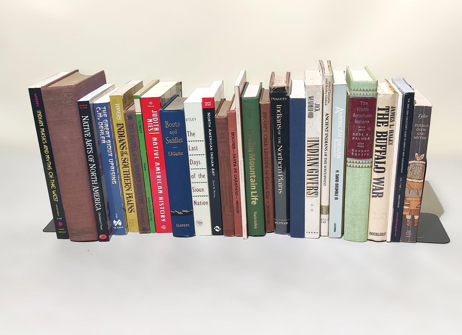 27 American Indian Books Incl "Boots and Saddles": NOT ELIGIBLE FOR IN-HOUSE SHIPPING. Includes topics on Rocky Mountain histories and life, Buffalo War, Mythology, overall histories, and much more. Condition: Overall good.