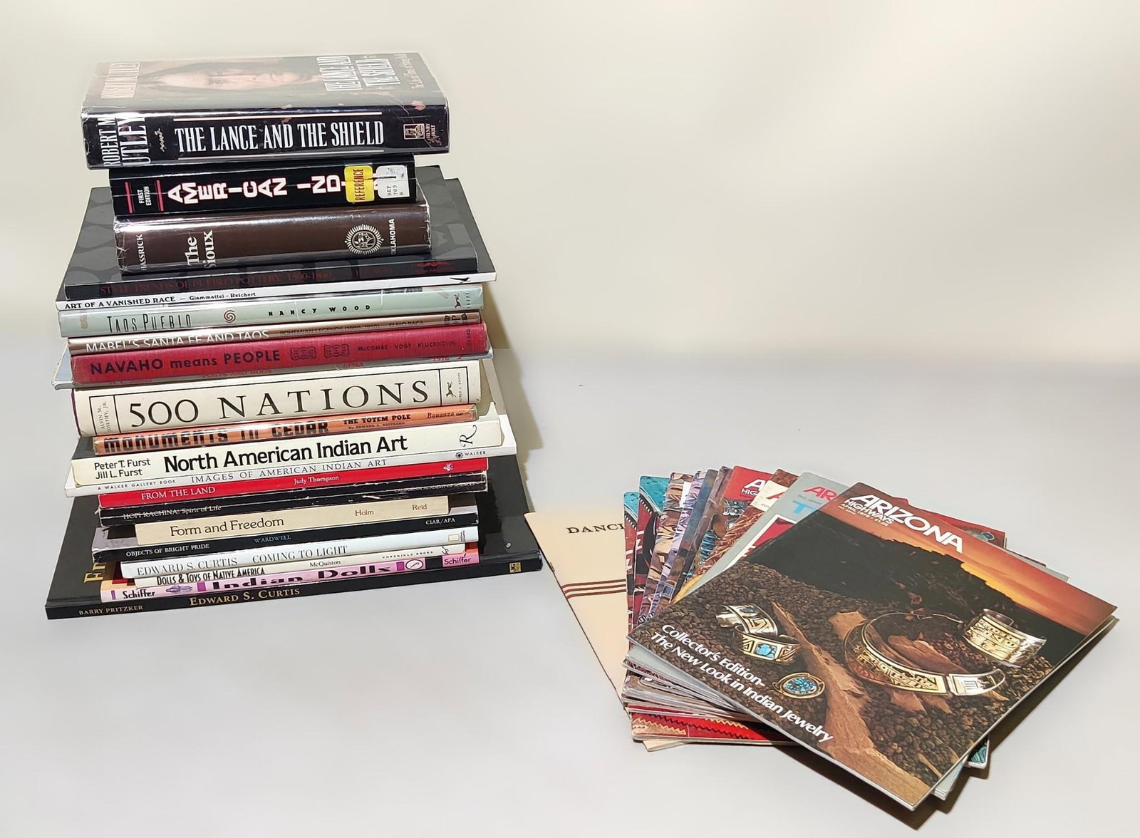 32 American Indian Books Incl Arizona Highway Magazine: NOT ELIGIBLE FOR IN-HOUSE SHIPPING. Includes topics such as American Indian Art, Navajo, Edward Curtis, dolls and toys, and much more. Condition: Overall good.