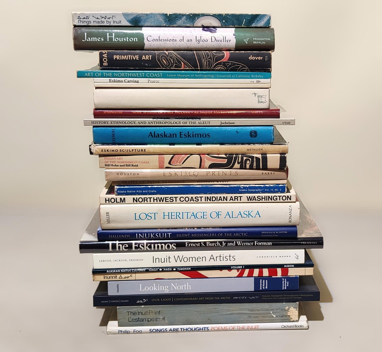 26 Inuit, Eskimo, and Alaskan American Indian Books: NOT ELIGIBLE FOR IN-HOUSE SHIPPING. Includes topics such as poetry, art, contemporary art, images, overall analysis of art, and sculpture. Condition: Overall good.