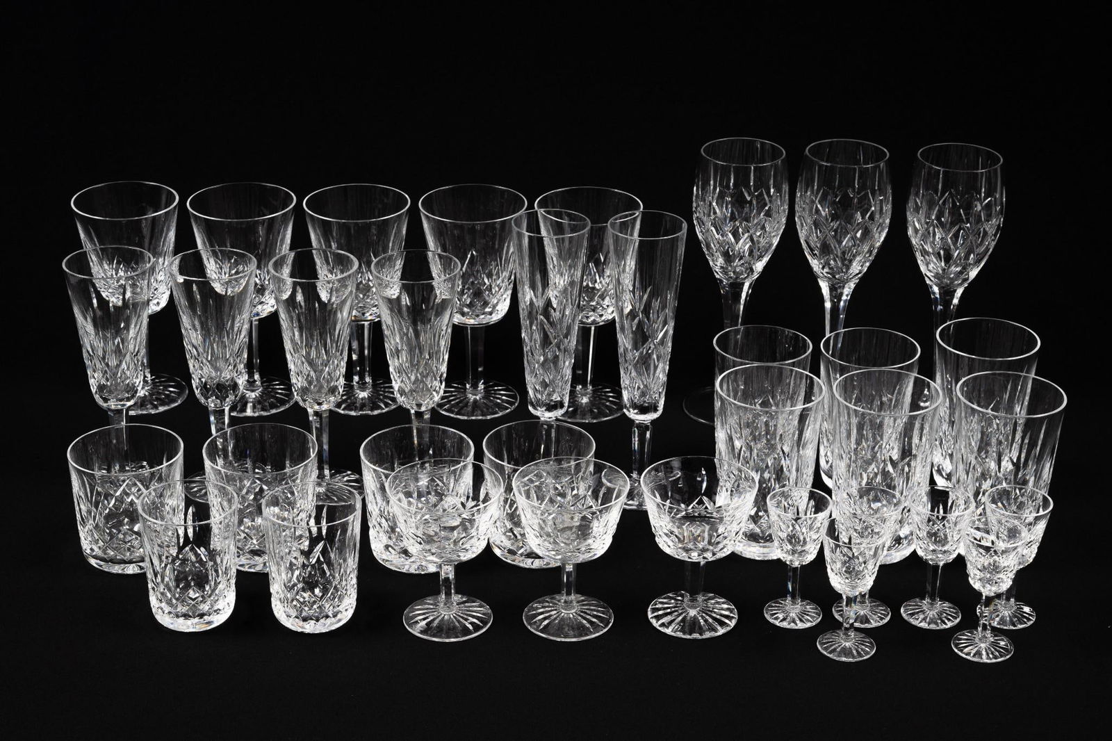 35 Pcs Waterford Glassware: Also includes Tiffany and Co. Includes goblets, wine glasses, and more. 3-1/2" to 8-3/4" high.