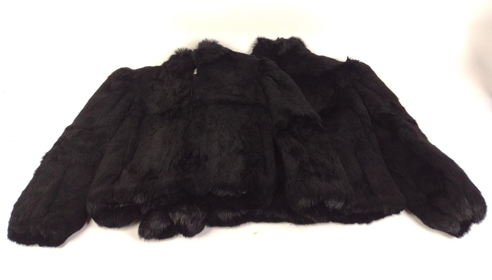 2 Princess Caravelle Rabbit Fur Coats: NOT ELIGIBLE FOR IN-HOUSE SHIPPING. Zip up closure. Includes size 10 and size 14. Shell 100% rabbit fur. Lining is acetate.