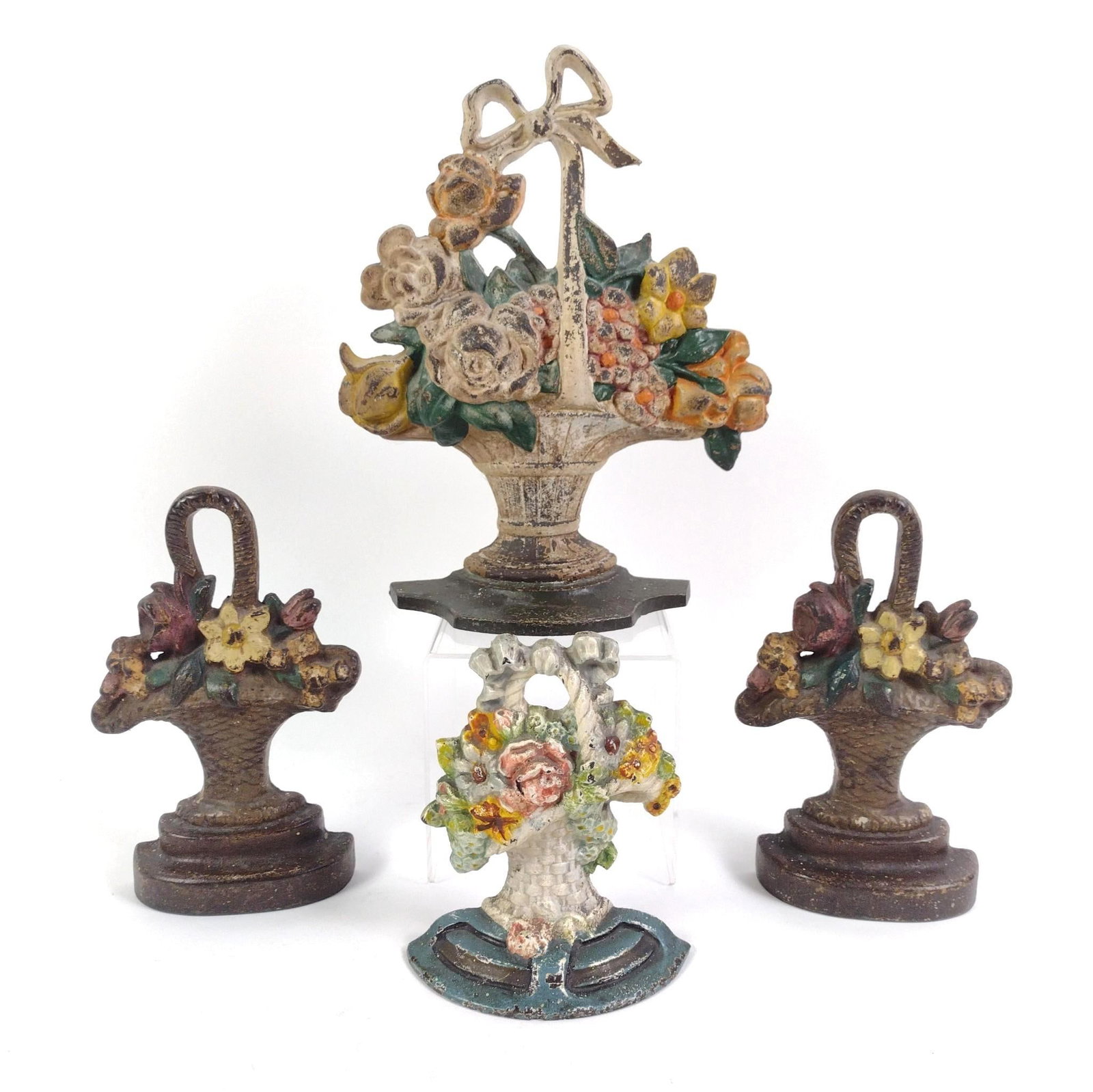 4 Floral Door Stops: Paint losses. 6" to 10-1/2" high.