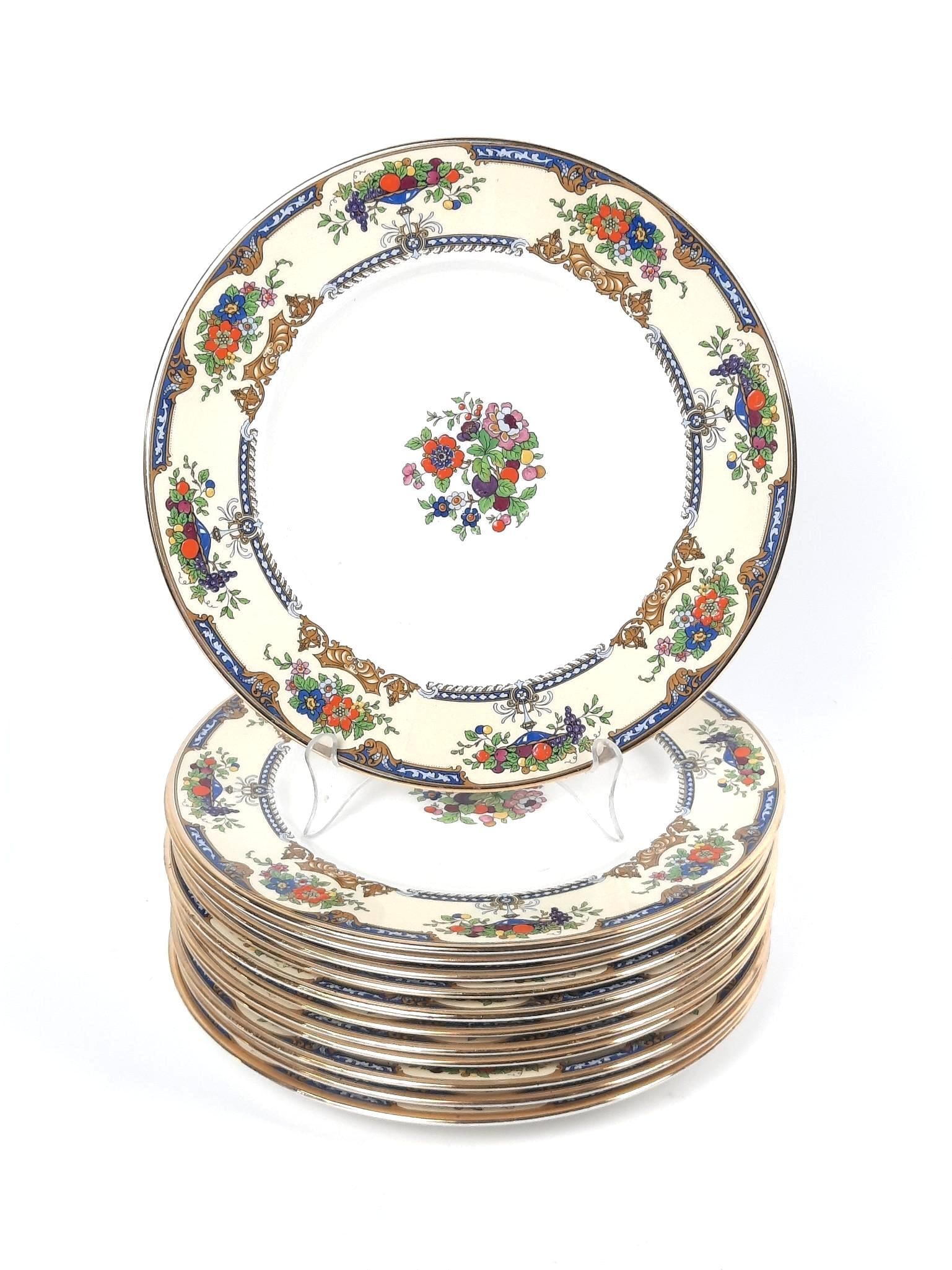 12 Myotts "Crown Ivory" Plates: Fruit design. 11" diameter. All with crazing.