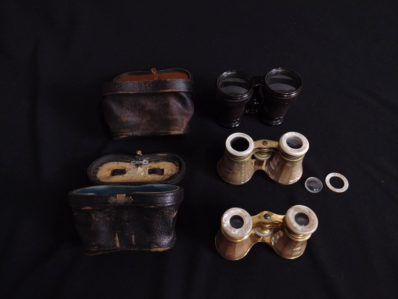 3 Prs Opera glasses: Includes 2 with mother of pearl. 2 with original cases. 4" to 4-1/2" wide x 2-1/2" to 3" high.