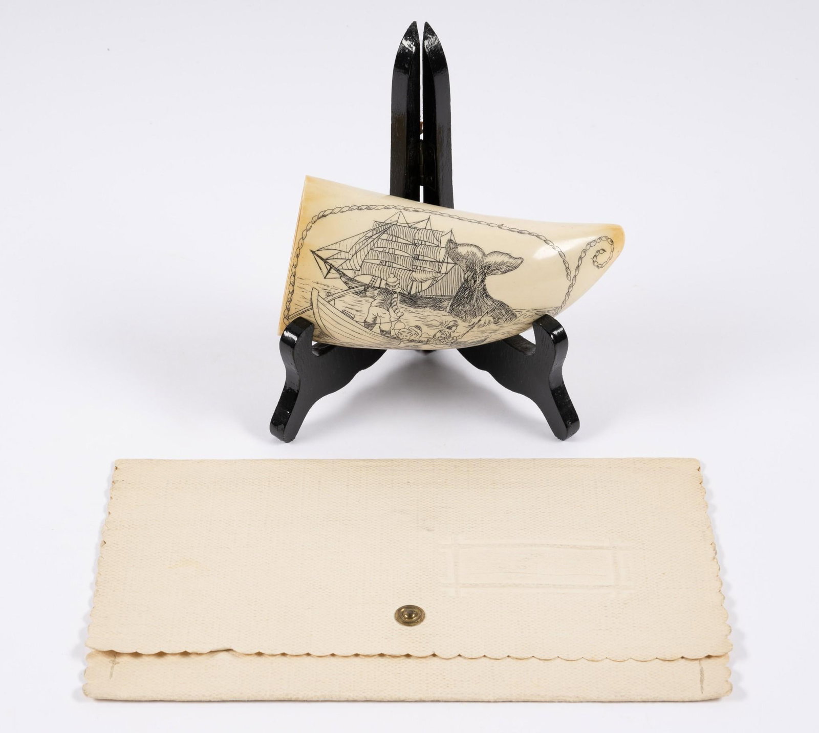 Scrimshaw Horn & German WWII Christmas Card: Horn features whaling scene. Christmas card signed by Julius Schaub. Julius Schaub was the Adjutant des Fuhrers during World War II. Horn measures 2-5/8" wide x 5-1/4" long.