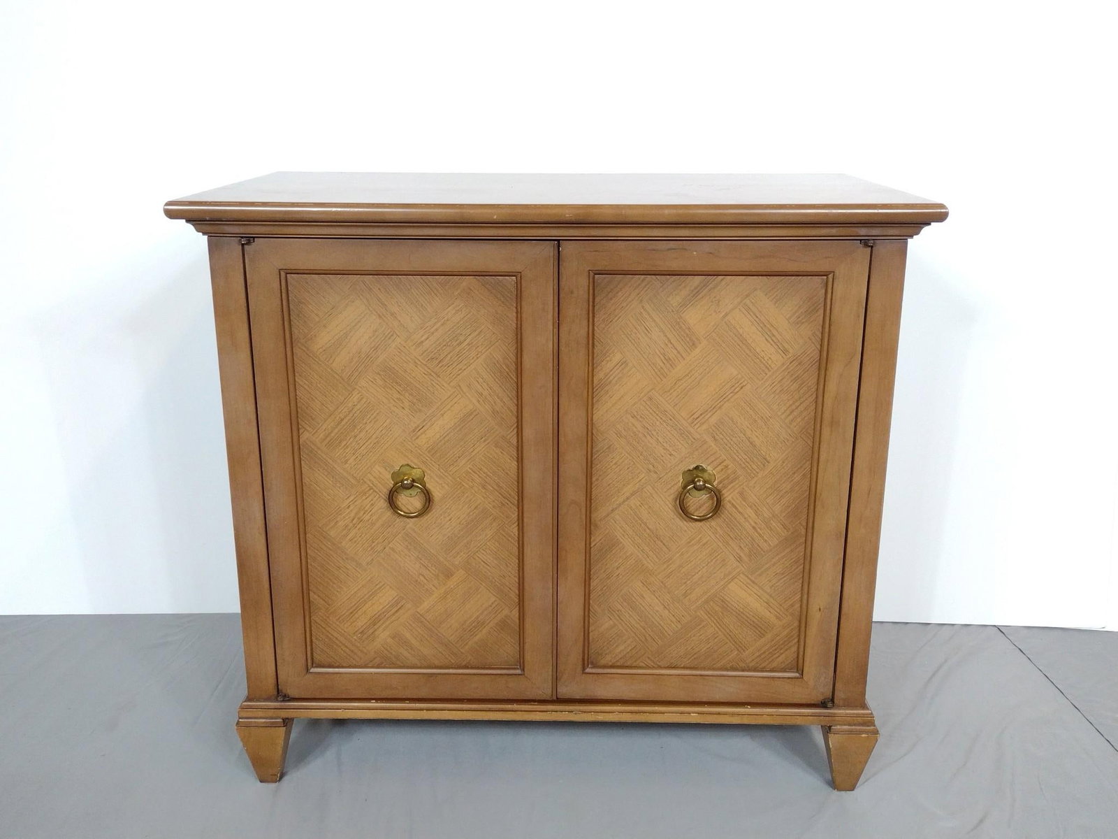 Low Cabinet: NOT ELIGIBLE FOR IN-HOUSE SHIPPING. 34" wide X 18" deep X 30-1/4" high. No manufactures name found. Has some finish loss around bottom edge.