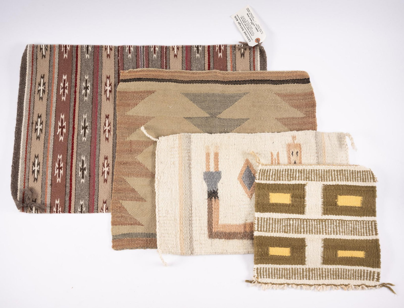 4 Navajo Weavings: DESCRIPTION: A group of four Navajo weavings all second half of the twentieth century. The first a Crystal with a Pfoutz tag stating made by Lisa Herbert. The second a single Yei. The third a geometri