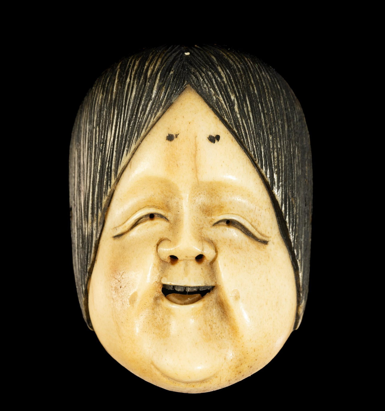 Carved Bone Noh Mask Netsuke: DESCRIPTION: 19th century Meiji Japanese Noh mask Netsuke. Netsuke are a miniature sculpture, originating in 17th century Japan. It was initially a simply-carved button fastener on the cards of an inr