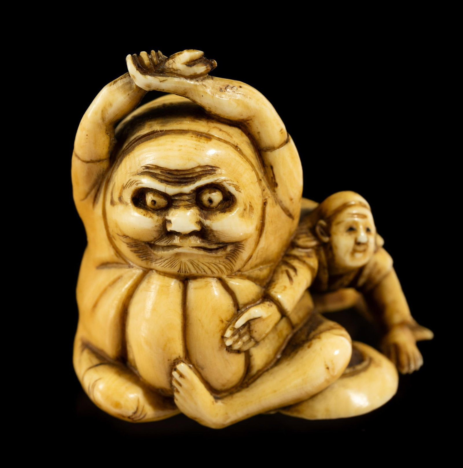 Carved Bone Katabori Netsuke: DESCRIPTION: 19th century Meiji Japanese Katabori Netsuke. Male figure with what appears to be a Nuppeppo. Netsuke are miniature sculpture, originating in 17th century Japan. It was initially a simply