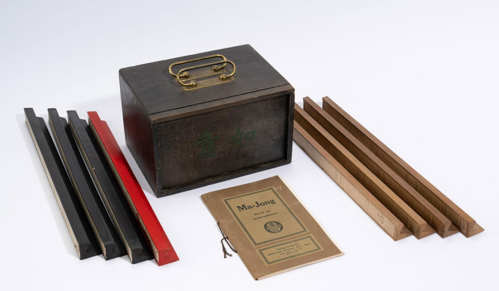 1920's Mah Jong Set in Original Box: DESCRIPTION: Long Sang Ti Chinese Curios Inc mah jong set with original box. Also includes original instruction manual. Includes 144 original tiles, eight tile racks, counters, six die, and position i