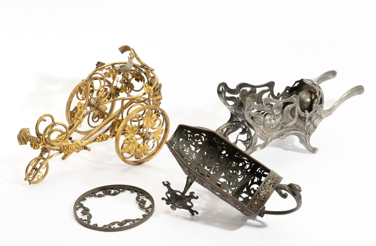 3 French Antique Wine Chariots: DESCRIPTION: Includes a gilt gold wine trolley with wine tilt adjustment by acme threaded screw, grape cluster and grape leaf castings wired to the frame as decoration, signed Brunet; pewter wine trol