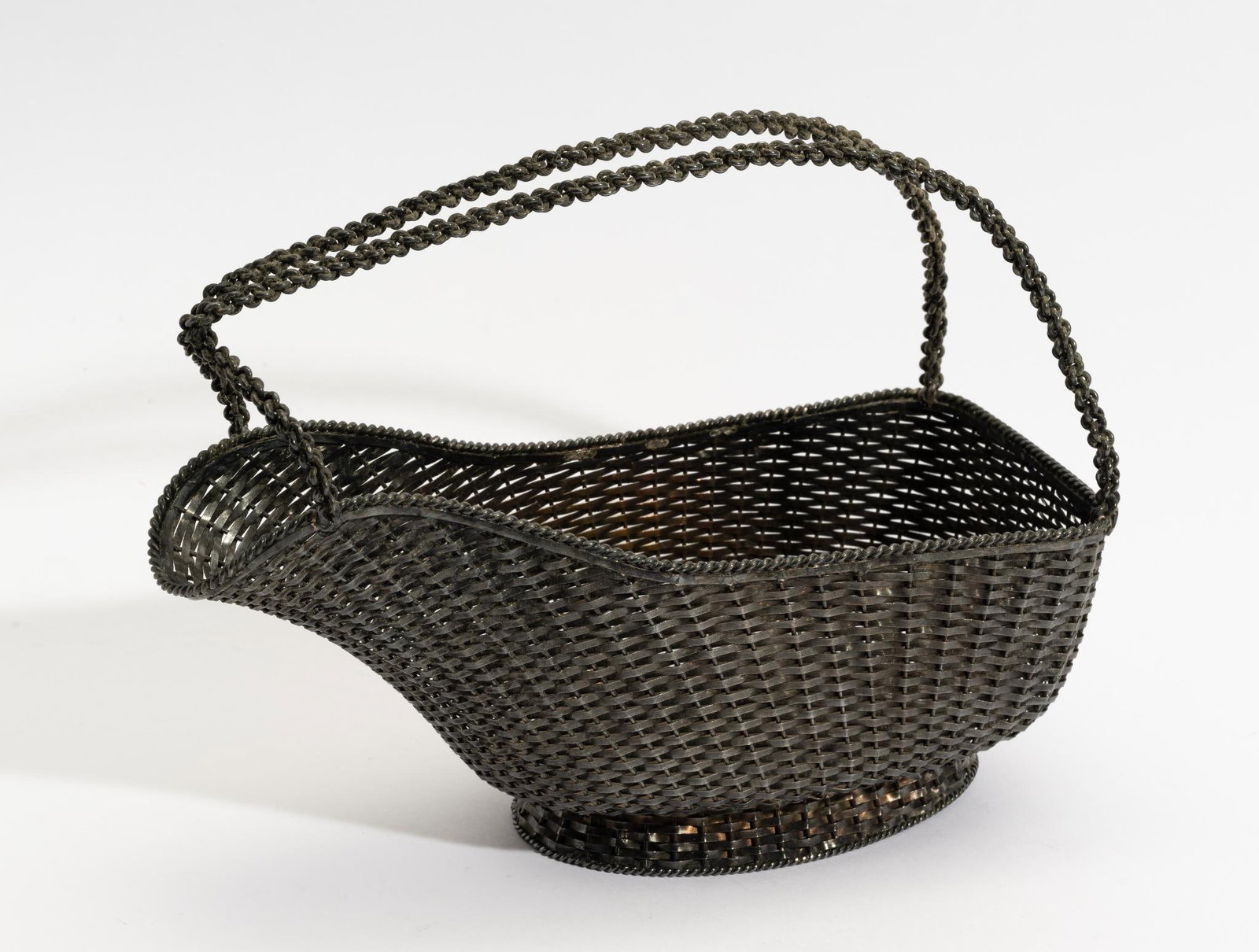 Sterling Silver Woven Wine Basket: DESCRIPTION: Finely woven basket by Alfredo Villasana Taxco Mexico, fully stamped. Unpolished. MEASUREMENT: 10" long. Total 14.7 ozt.