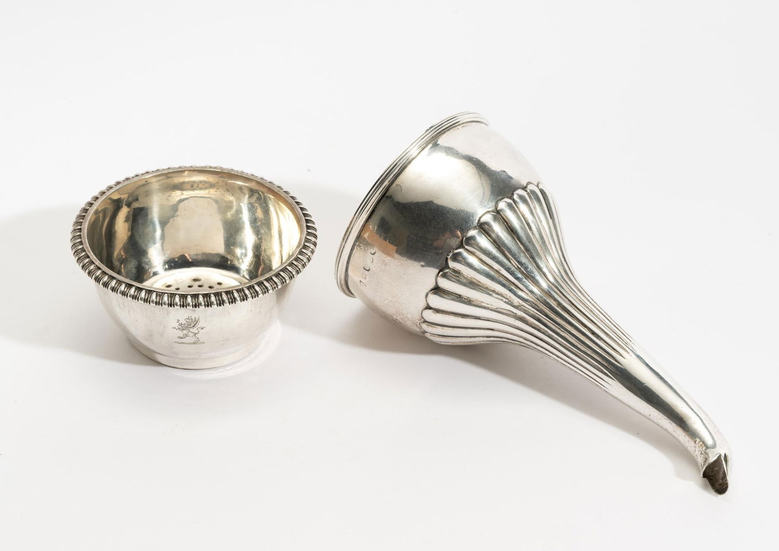 Antique English Sterling Silver Wine Funnel: DESCRIPTION: Funnel is two pieces and both pieces are stamped and both with coats of arms/hallmark consisting of a griffin. MEASUREMENT: 6" high and 5.6 ozt total.