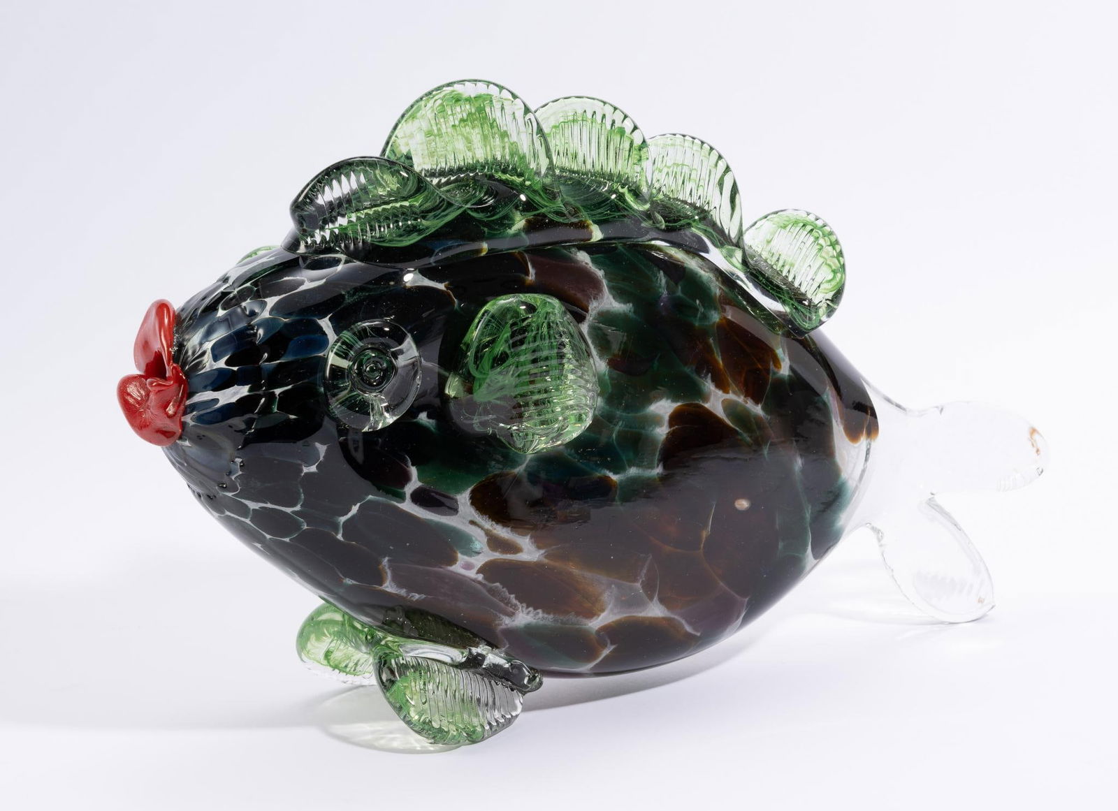 Jean-Claude Novaro (French, 1943 - 2015): DESCRIPTION: Jean Claude Novaro "Spotted Poisson, Green" fish artistic glass sculpture. Fish with green and blue spots. Jean Claude Novaro was a French artist considered one of the greatest glass make