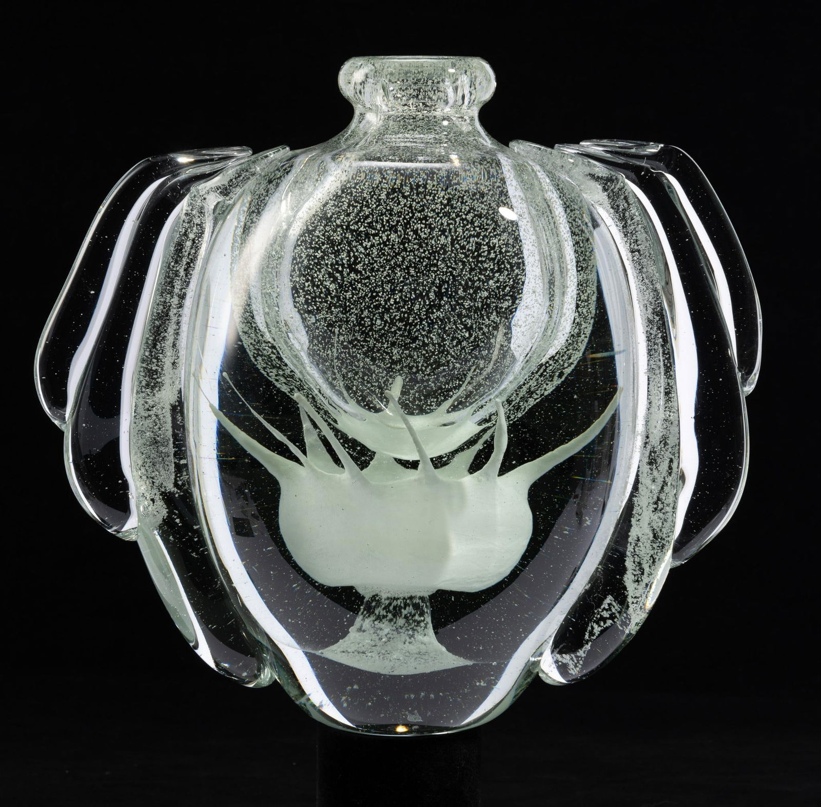 Jean-Claude Novaro (French, 1943 - 2015): DESCRIPTION: "Happy Angel Vase Fluo". Clear glass vase with white design on bottom. Signed 2009. Jean Claude Novaro was a French artist considered one of the greatest glass makers of the 20th century.