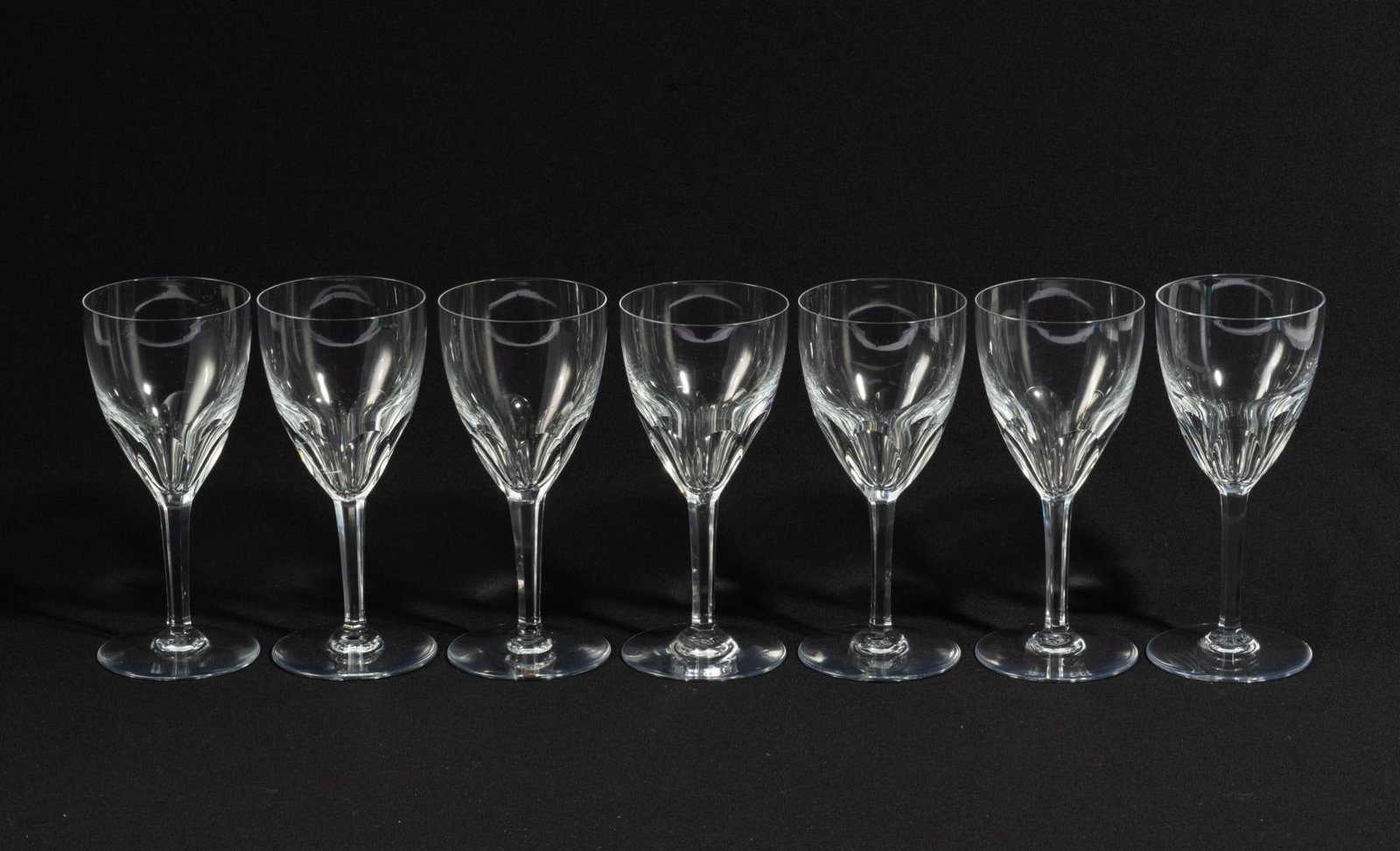8 Baccarat Genova Wine Glasses: DESCRIPTION: Eight Baccarat Genova wine glasses. All marked. Baccarat is a luxury manufacturer of fine crystal located in France. MEASUREMENT: 3-3/8" diameter x 7-1/2" high.