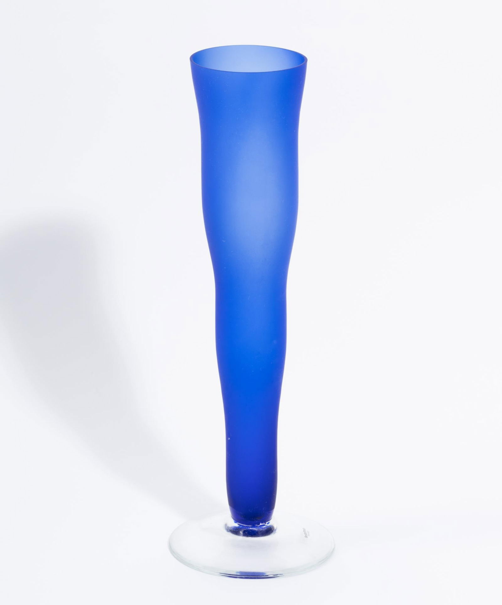 Boda Shop Blue Vase: DESCRIPTION: Blue vase with clear glass bottom. Sticker on the bottom. MEASUREMENT: 4-3/4" wide x 14-1/4" high.