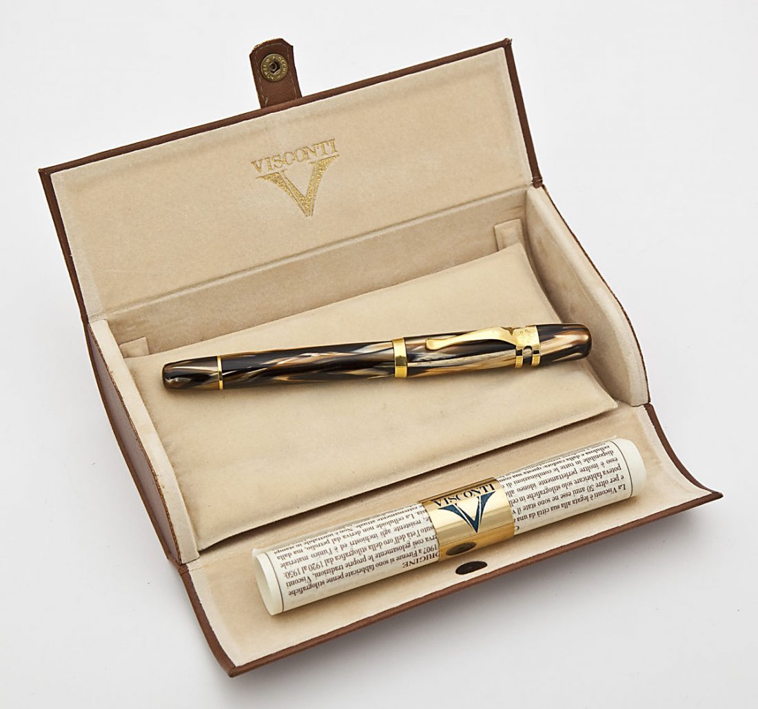 Visconti Firenze Italia Ragtime Fountain Pen: DESCRIPTION: Visconti Firenze Italia Ragtime cinnabar fountain pen with a 110.24 medium point and 18K gold nib. In its original boxes, interior leather box and exterior cardboard box, and with paperwo