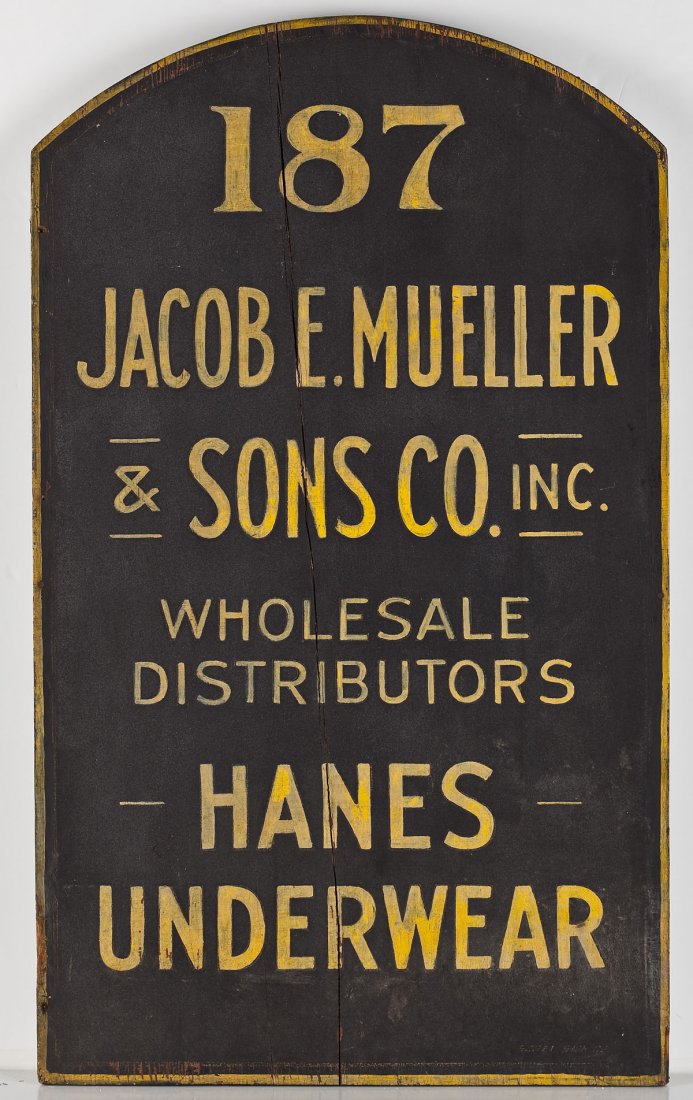 Jacob E. Mueller & Sons Co. Hanes Underwear Sign: DESCRIPTION: Jacob E. Mueller & Sons Company Incorporated Hanes underwear wood sign. Black painted ground with a yellow border and inscribed, "187 Jacob E. Mueller, & Sons Co. Inc. Wholesale Distribut