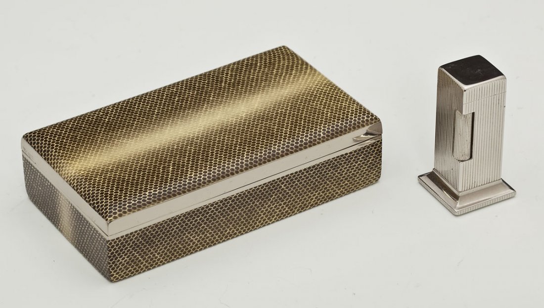 Dunhill Lighter & German Faux Snakeskin Box: DESCRIPTION: Dunhill Rollalite table lighter and German faux snakeskin box. Lighter marked "Dunhill," at the top and "Dunhill Rollalite U.S. Pat. No. 2.102.108," on the bottom. Faux snakeskin hinged b