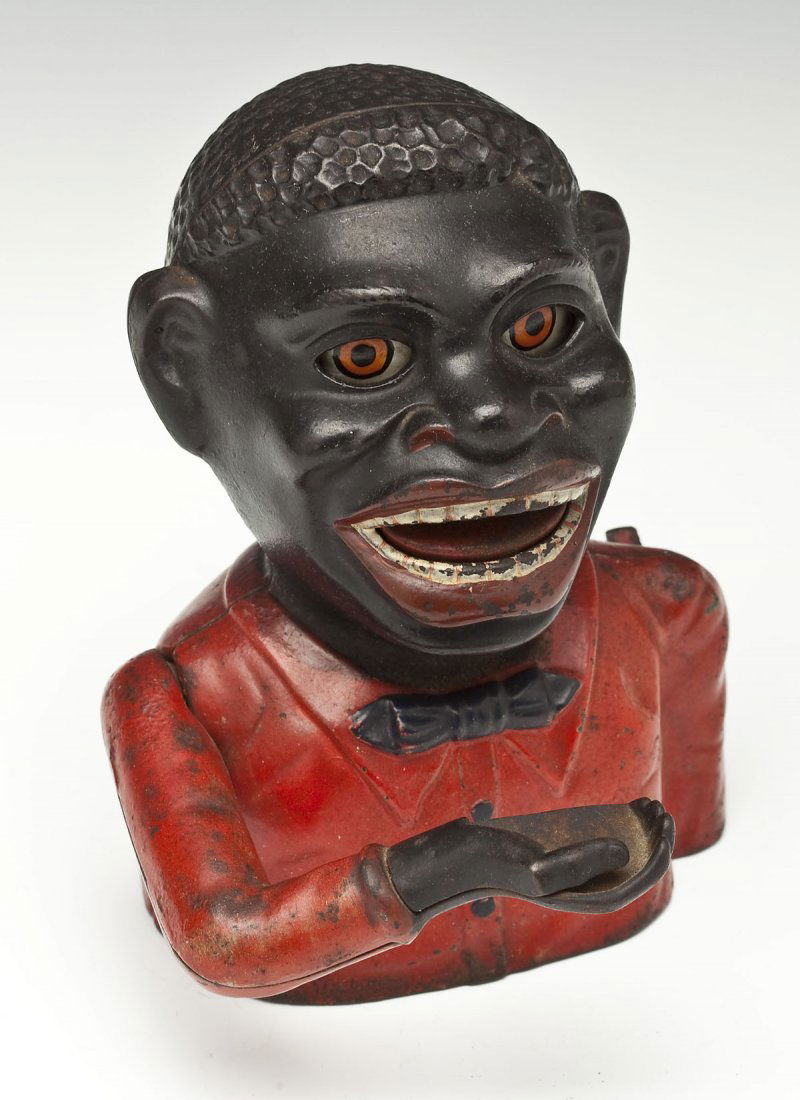 Jolly "N" Mechanical Bank: DESCRIPTION: Jolly "N" mechanical bank. Painted cast iron. Base marked "Manufactured by the J.E. Stevens & Co. Cromwell, Conn. USA". MEASUREMENTS: 6-1/2". CONDITION: Excellent overall appearance. Miss