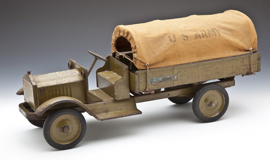 Keystone Packard Model U.S. Army Truck: DESCRIPTION: Keystone Packard model U.S. Army pressed steel troop transport truck with canvas domed top marked "U.S. Army," on both sides. Olive green pressed steel structure with an open cab and with