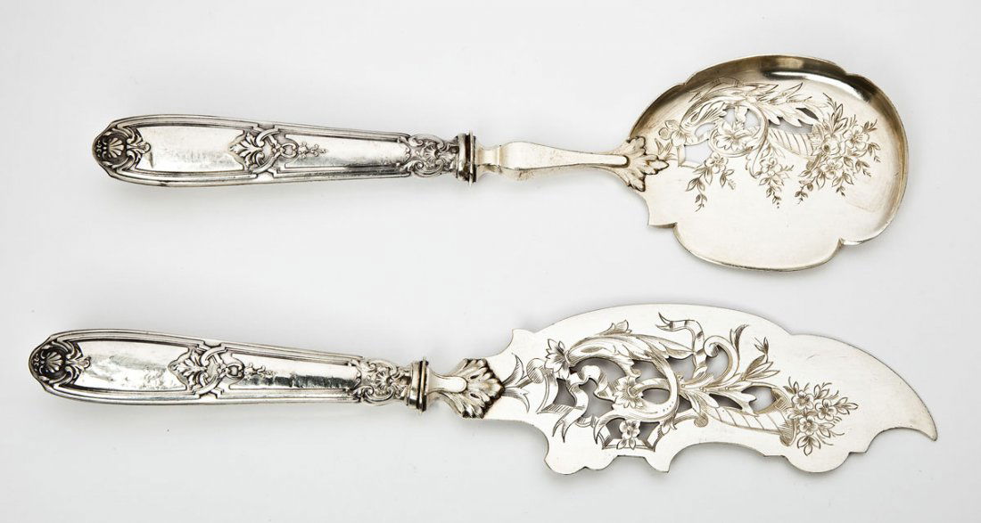 French 2 Pc Sterling Handled Fish Set: DESCRIPTION: French two piece sterling silver handled fish set with a reticulated and etched spoon and knife. Handles with a decorative design and with a hallmark, at the top of the handle, probably t