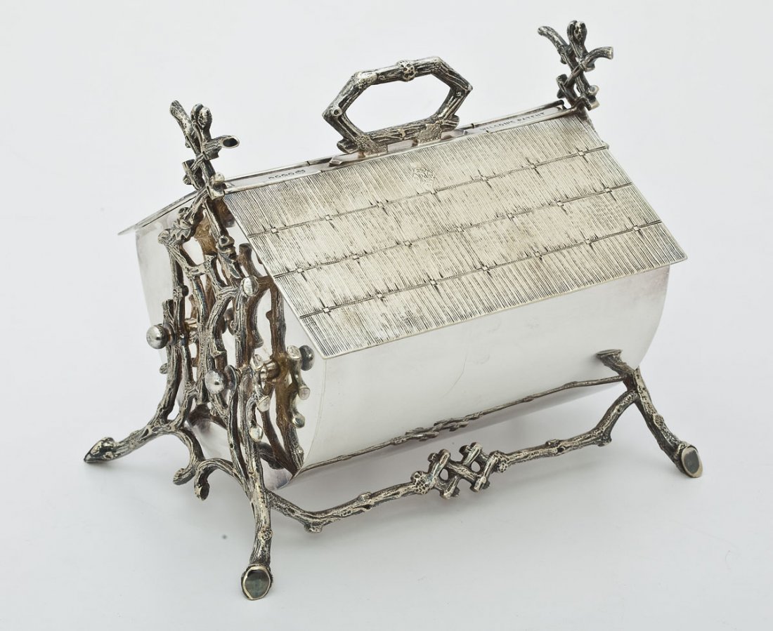 19th C English Silverplate Biscuit Box: DESCRIPTION: Frederick Wilson and William (Pittman) Davis, London & Sheffield, England silverplate biscuit box. 1877. With an intertwined branch base and legs with a thatched roof design. Marked "Wils