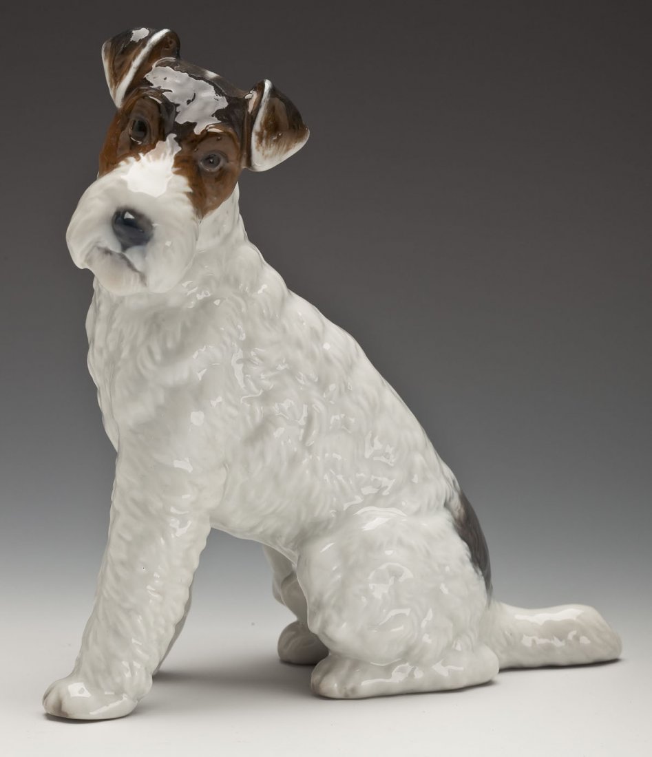 Rosenthal Porcelain Terrier Figurine #1242: DESCRIPTION: Rosenthal hand painted porcelain fox terrier figurine designed by Max Daniel Hermann Fritz, model number 1243. Marked with the Rosenthal hallmark, on the bottom. Circa 1930's to 1940's. M