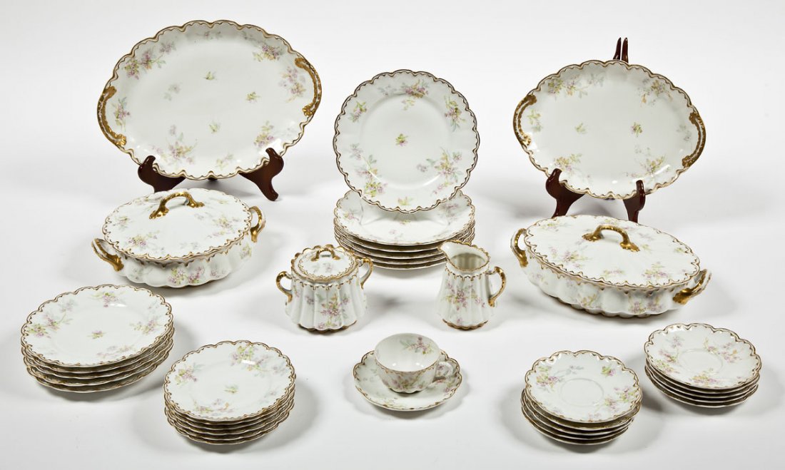 Théodore Haviland Limoges 35 Pc Dinner Service: DESCRIPTION: Théodore Haviland Limoges, France thirty-five piece dinner service in a floral pattern with a scalloped gilt rim. Circa 1926. Includes: Six each of 8-5/8" luncheon plates, 6-1/4" dessert