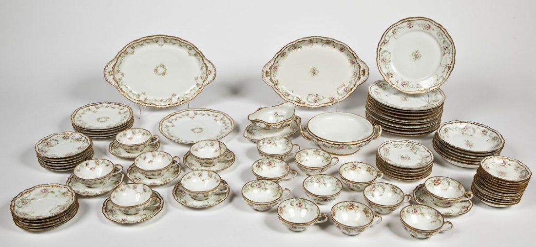 Théodore Haviland Limoges 79 Pc Dinner Service: DESCRIPTION: Théodore Haviland Limoges, France eighty piece dinner service. All pieces of the same blank with scalloped gilt rims and decorated in two different complimentary floral patterns. Include