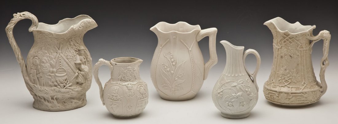 5 19th C Parian & Salt Glaze Pitchers: DESCRIPTION: Five 19th century English and American Parian and salt glaze pitchers. 1) White Parian pitcher with an applied handle and a rope and floral design. 8" high. 2) Jones & Walley, Corridor Gi