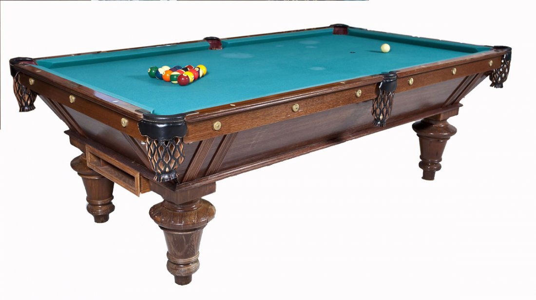 Antique Brunswick Balke Collender Pool Table: DESCRIPTION: Antique Brunswick Balke Collender pool table with green felt covered three part slate top and carved wood frame with four turned and tapered feet. Leather pockets. Frame hardware marked "