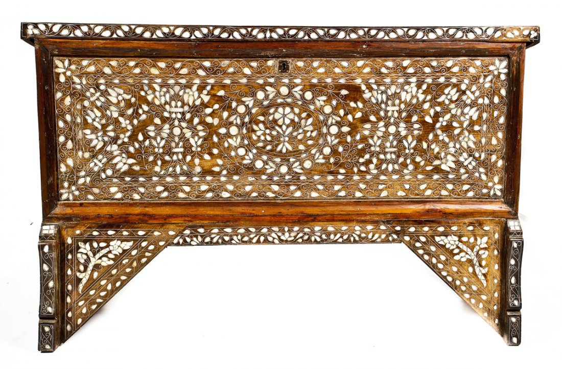 Middle Eastern High Chest: DESCRIPTION: A high chest resting upon elevated cut wooden panels and profusely inlaid with mother of pearl. Front and base inlaid with floral twining. Top and sides with simple curvilinear decoration