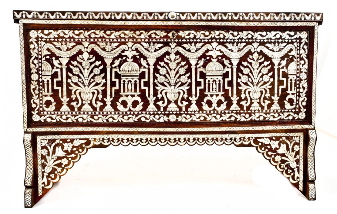 Middle Eastern High Chest: DESCRIPTION: A high chest resting upon elevated cut wooden panels and profusely inlaid with mother of pearl. Front and base heavily inlaid with temples and urns of flowers. Top and sides with ornate f