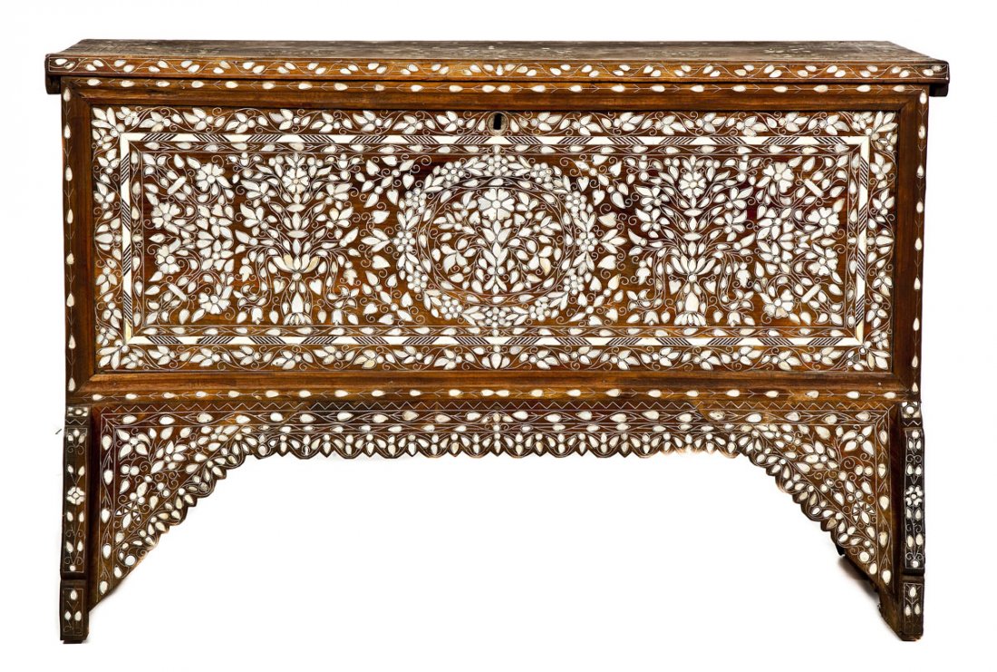 Middle Eastern High Chest: DESCRIPTION: A high chest resting upon elevated cut wooden panels and profusely inlaid with mother of pearl. Front and base inlaid with urns and swags of flowers. Top and sides with simple curvilinear