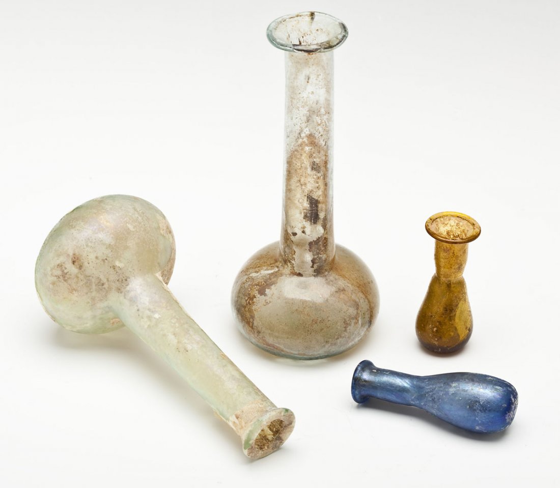 4 Ancient Roman Miniature Iridescent Vessels: DESCRIPTION: A group of four ancient Roman miniature iridescent glass vessels. Includes: 1) Two clear glass bottle neck vases. 4". 2) Blue iridescent vessel. 1-7/8". 3) Gold iridescent vessel. 1-5/8".