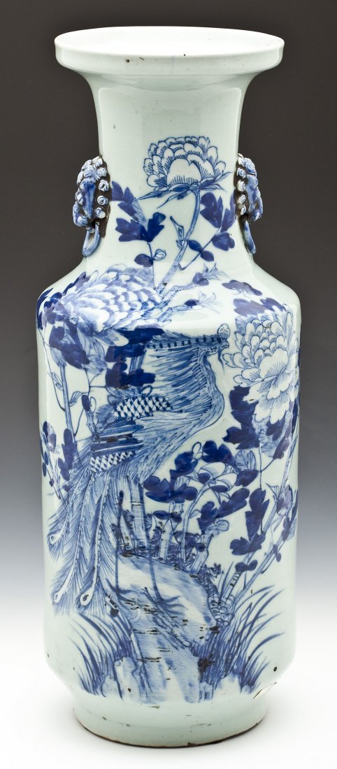 Chinese Blue & White Floor Vase: DESCRIPTION: Chinese blue and white floor vase with two blue lion head handles. White ground with blue decoration of a bird amongst flowers. MEASUREMENTS: 22-3/4" high. CONDITION: Some paint loss.