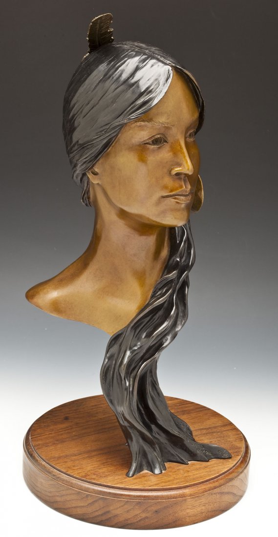 James Roybal (American, B. 1952): DESCRIPTION: James Roybal (American, B. 1952). Lorraine. Circa 1981. Bronze on circular wood base. Signed, titled, and numbered 15/25, lower right. Depicts a bust of a woman with a feather in her hair