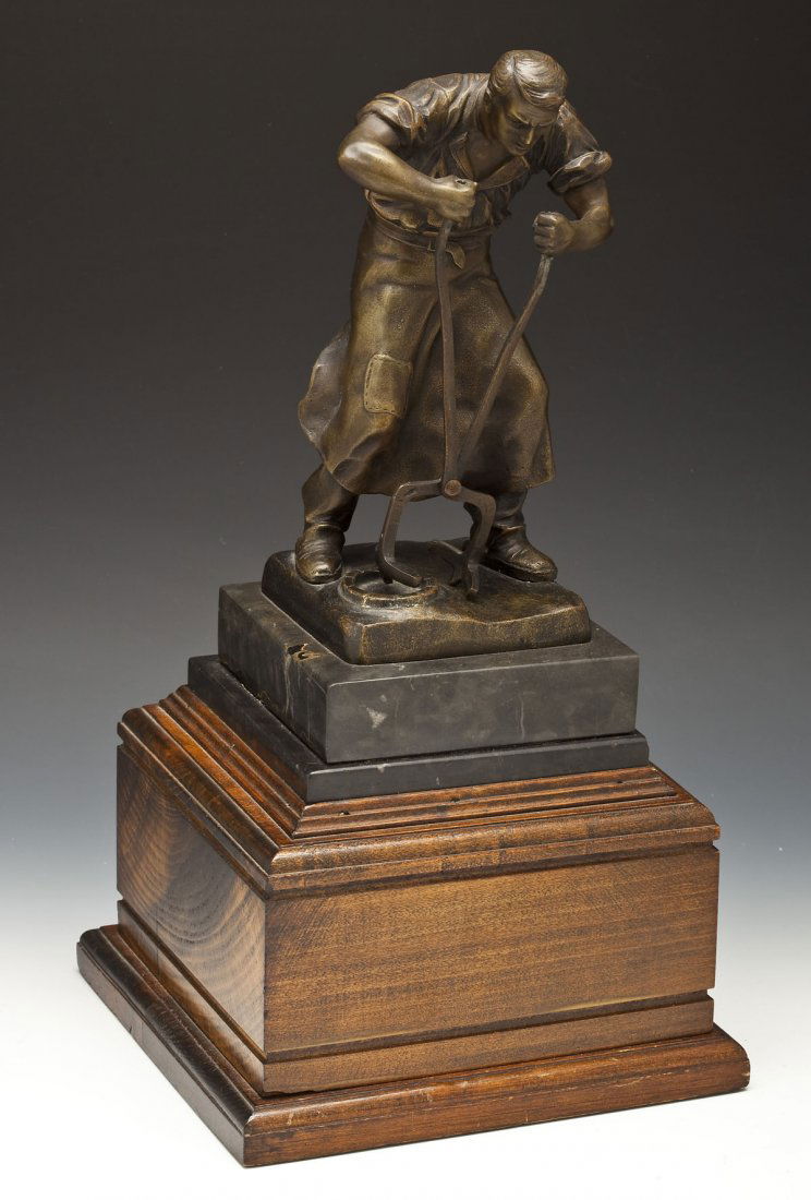 Otto Schmidt-Hofer (German, 1873-1925): DESCRIPTION: Otto Schmidt-Hofer (German, 1873-1925). Bronze sculpture of an industrial worker on a marble platform attached to a wooden pedestal. Signed, verso. MEASUREMENTS: 8-1/2" high. Overall with