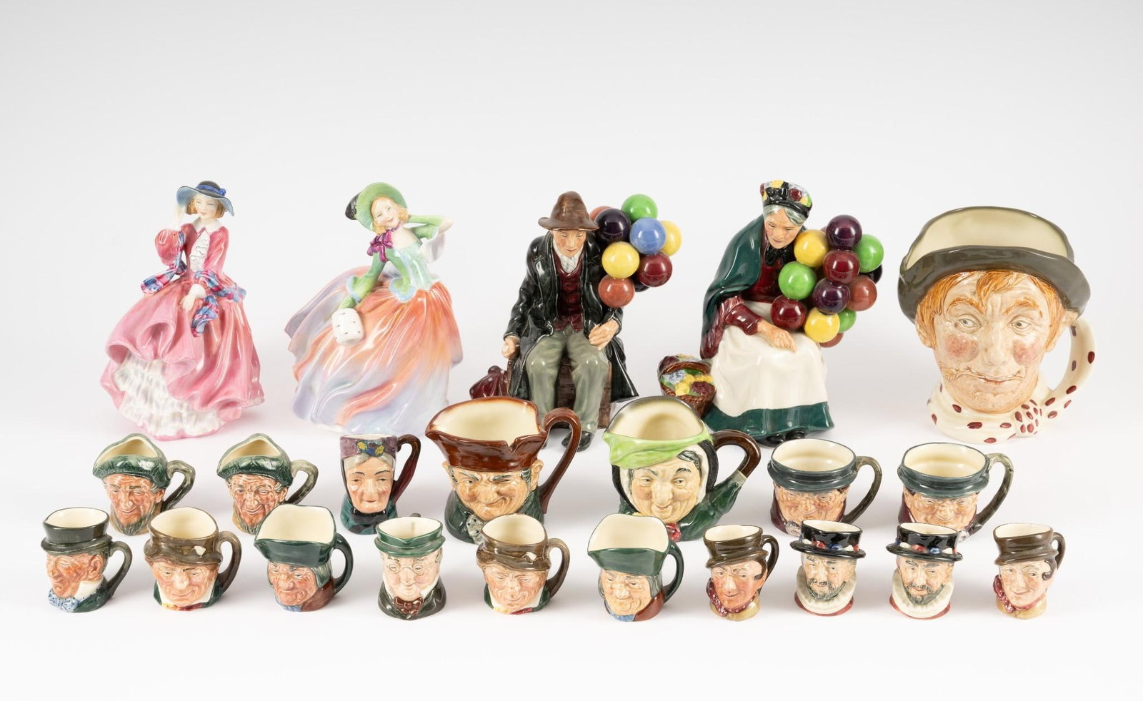 22 Royal Doulton and Clayton Figurines / Toby Mugs: 2-1/4" to 7-3/4" high.