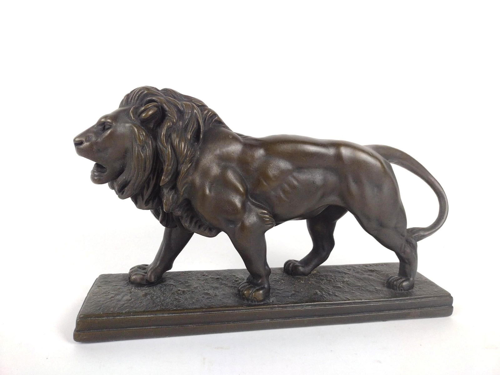 Aft. Barye Lion Sculpture: Made of plaster. 16" long x 4" deep x 9" high.