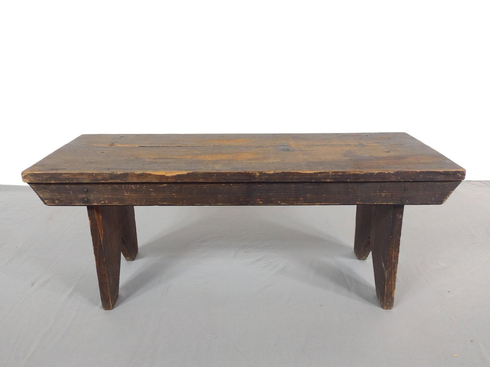 Primitive Wood Bench: NOT ELIGIBLE FOR IN-HOUSE SHIPPING. 30" wide x 12" deep x 12" high. Some losses to wood and overall wear consistent with age and use.