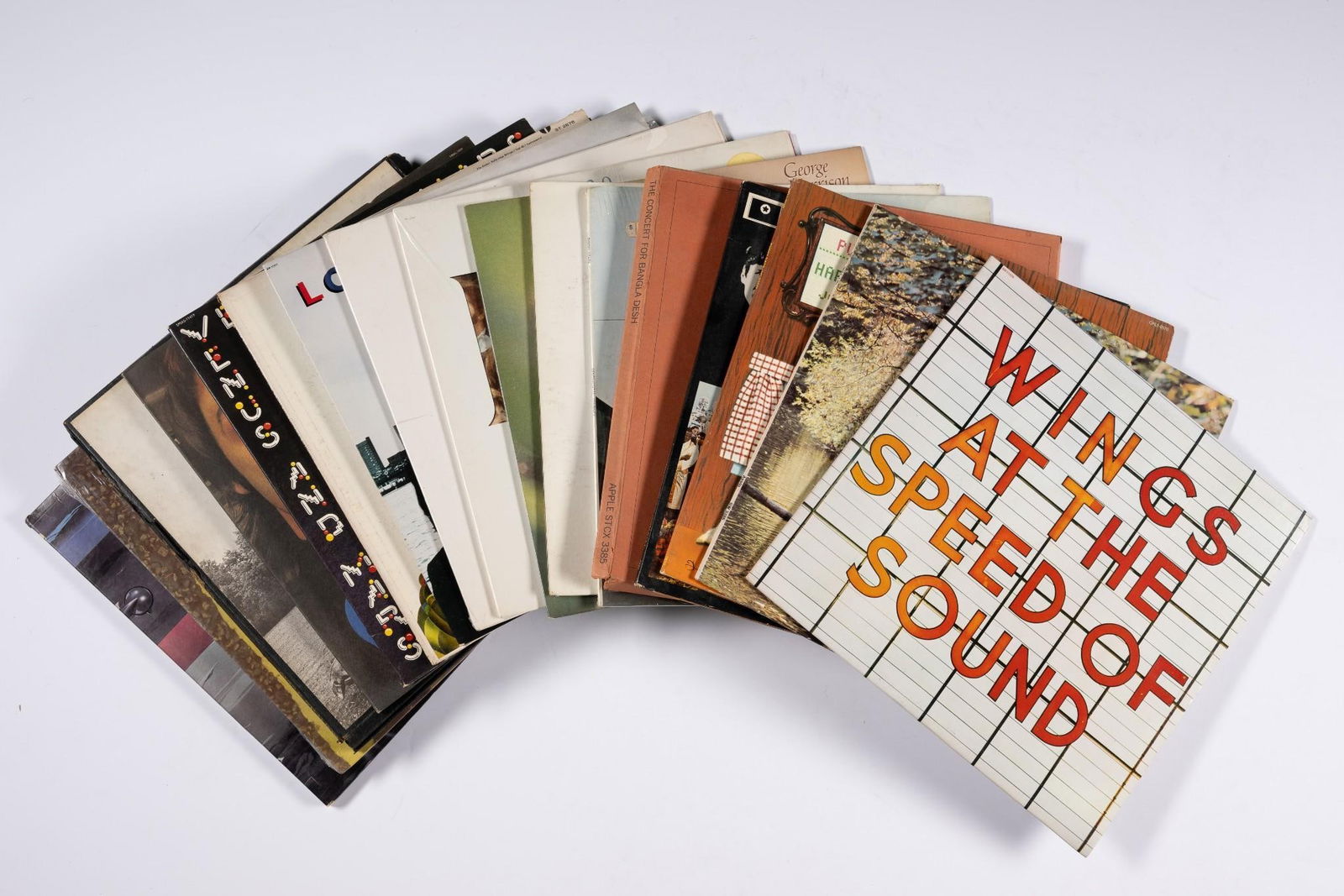 17 Beatles / Beatles Members Solo Work Records: Includes The Beatles, George Harrison, Ringo Starr, Paul McCarney / Wings,and Produced by John Lennon. NOTICE: Records have not been reviewed outside of covers. Some wear and residue to covers due to